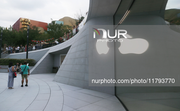 Customers shop at the largest Apple flagship store in Asia in Shanghai, China, on September 22, 2024. 