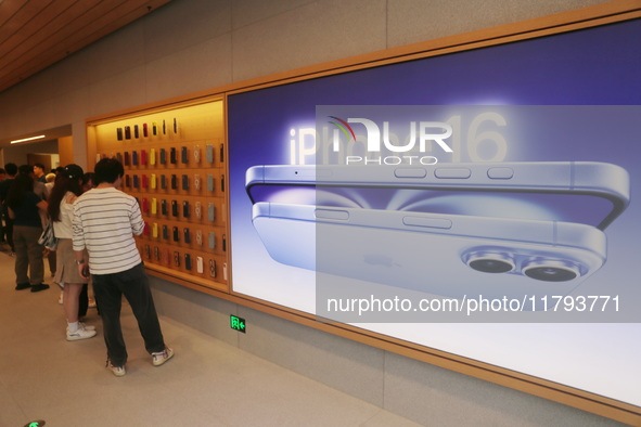 Customers shop at the largest Apple flagship store in Asia in Shanghai, China, on September 22, 2024. 