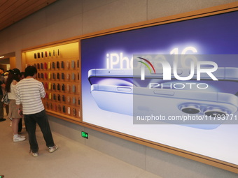 Customers shop at the largest Apple flagship store in Asia in Shanghai, China, on September 22, 2024. (