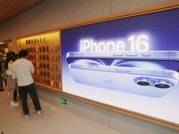 Customers shop at the largest Apple flagship store in Asia in Shanghai, China, on September 22, 2024. (