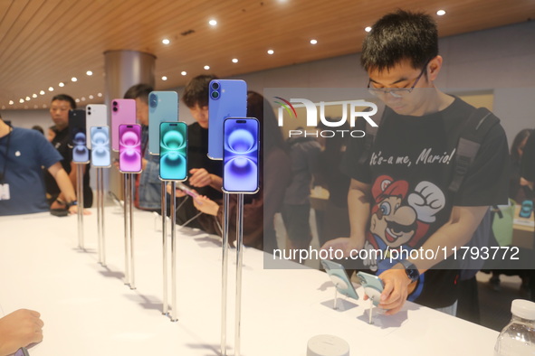 Customers shop at the largest Apple flagship store in Asia in Shanghai, China, on September 22, 2024. 