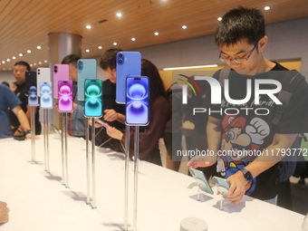 Customers shop at the largest Apple flagship store in Asia in Shanghai, China, on September 22, 2024. (