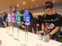 Customers shop at the largest Apple flagship store in Asia in Shanghai, China, on September 22, 2024. (