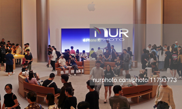 Customers shop at the largest Apple flagship store in Asia in Shanghai, China, on September 22, 2024. 