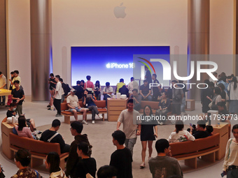 Customers shop at the largest Apple flagship store in Asia in Shanghai, China, on September 22, 2024. (