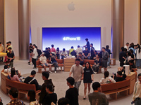 Customers shop at the largest Apple flagship store in Asia in Shanghai, China, on September 22, 2024. (