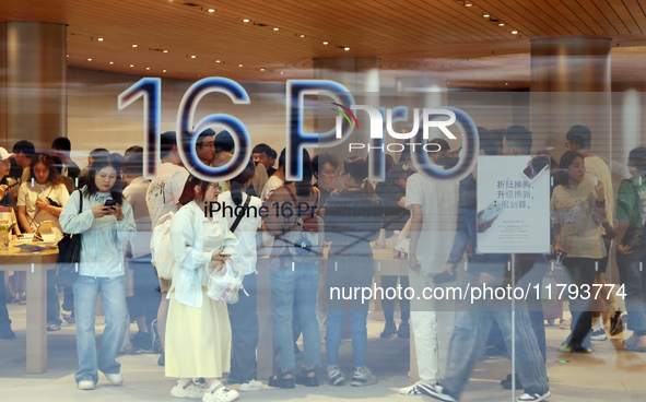 Customers shop at the largest Apple flagship store in Asia in Shanghai, China, on September 22, 2024. 