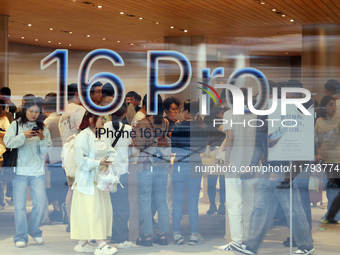 Customers shop at the largest Apple flagship store in Asia in Shanghai, China, on September 22, 2024. (