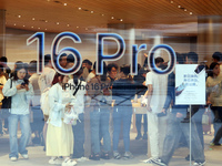 Customers shop at the largest Apple flagship store in Asia in Shanghai, China, on September 22, 2024. (