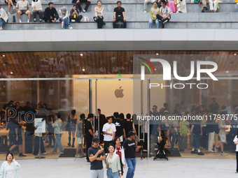 Customers shop at the largest Apple flagship store in Asia in Shanghai, China, on September 22, 2024. (