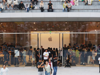 Customers shop at the largest Apple flagship store in Asia in Shanghai, China, on September 22, 2024. (