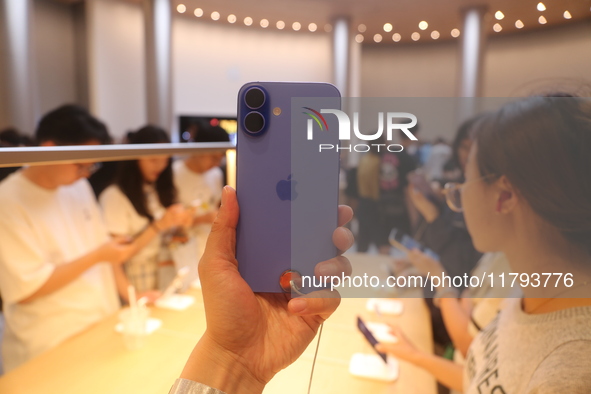 Customers shop at the largest Apple flagship store in Asia in Shanghai, China, on September 22, 2024. 