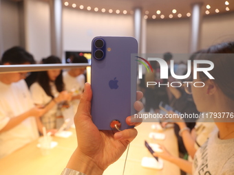 Customers shop at the largest Apple flagship store in Asia in Shanghai, China, on September 22, 2024. (