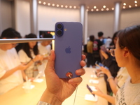 Customers shop at the largest Apple flagship store in Asia in Shanghai, China, on September 22, 2024. (