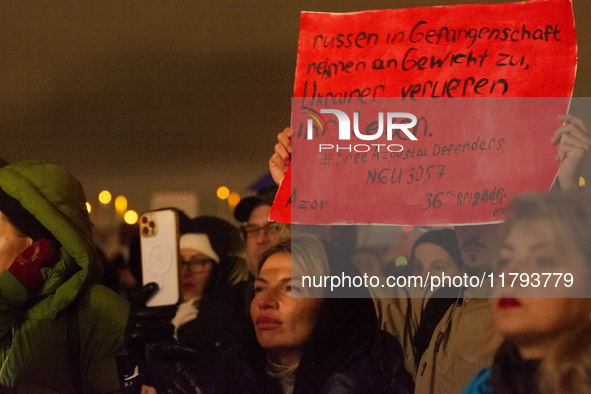 Two hundred people take part in a demonstration to mark 1,000 days since the full-scale war between Ukraine and Russia in Cologne, Germany,...