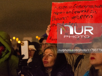 Two hundred people take part in a demonstration to mark 1,000 days since the full-scale war between Ukraine and Russia in Cologne, Germany,...