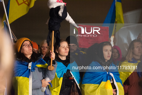 Two hundred people take part in a demonstration to mark 1,000 days since the full-scale war between Ukraine and Russia in Cologne, Germany,...