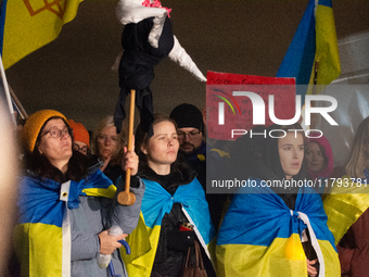 Two hundred people take part in a demonstration to mark 1,000 days since the full-scale war between Ukraine and Russia in Cologne, Germany,...