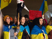 Two hundred people take part in a demonstration to mark 1,000 days since the full-scale war between Ukraine and Russia in Cologne, Germany,...