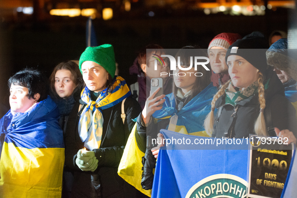 Two hundred people take part in a demonstration to mark 1,000 days since the full-scale war between Ukraine and Russia in Cologne, Germany,...