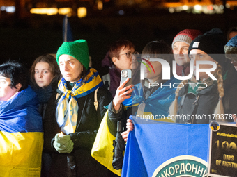 Two hundred people take part in a demonstration to mark 1,000 days since the full-scale war between Ukraine and Russia in Cologne, Germany,...