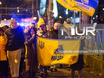 Two hundred people take part in a demonstration to mark 1,000 days since the full-scale war between Ukraine and Russia in Cologne, Germany,...