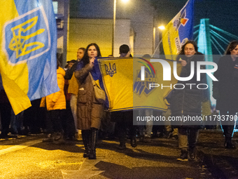 Two hundred people take part in a demonstration to mark 1,000 days since the full-scale war between Ukraine and Russia in Cologne, Germany,...