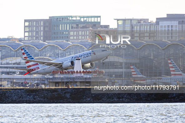 American Airlines Boeing 737 MAX 8 passenger aircraft spotted during takeoff and flying in front of the airport terminal, air traffic contro...