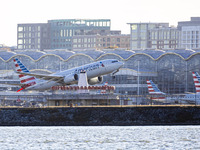 American Airlines Boeing 737 MAX 8 passenger aircraft spotted during takeoff and flying in front of the airport terminal, air traffic contro...