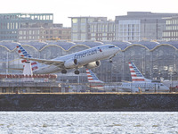 American Airlines Boeing 737 MAX 8 passenger aircraft spotted during takeoff and flying in front of the airport terminal, air traffic contro...