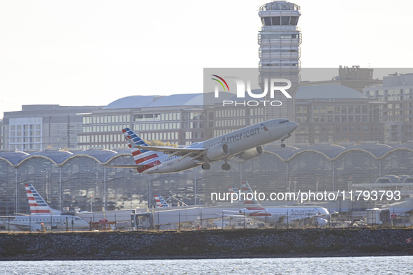 American Airlines Boeing 737 MAX 8 passenger aircraft spotted during takeoff and flying in front of the airport terminal, air traffic contro...