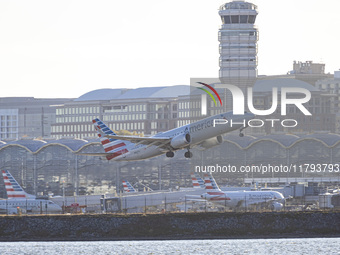 American Airlines Boeing 737 MAX 8 passenger aircraft spotted during takeoff and flying in front of the airport terminal, air traffic contro...