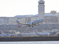 American Airlines Boeing 737 MAX 8 passenger aircraft spotted during takeoff and flying in front of the airport terminal, air traffic contro...