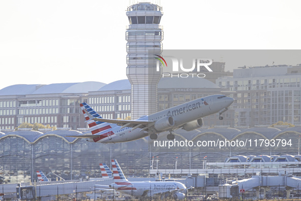 American Airlines Boeing 737 MAX 8 passenger aircraft spotted during takeoff and flying in front of the airport terminal, air traffic contro...