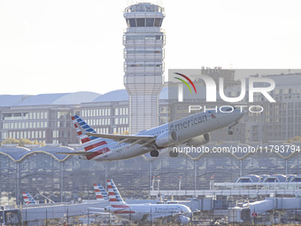 American Airlines Boeing 737 MAX 8 passenger aircraft spotted during takeoff and flying in front of the airport terminal, air traffic contro...