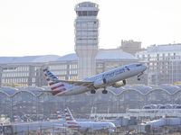 American Airlines Boeing 737 MAX 8 passenger aircraft spotted during takeoff and flying in front of the airport terminal, air traffic contro...