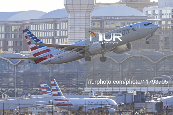 American Airlines Boeing 737 MAX 8 passenger aircraft spotted during takeoff and flying in front of the airport terminal, air traffic contro...