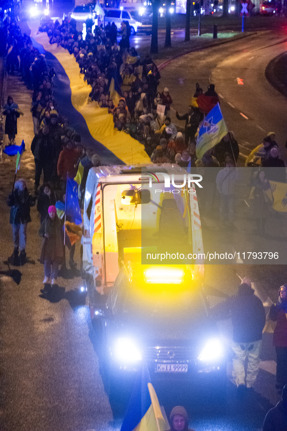 A destroyed medical vehicle is displayed as two hundred people march in silence to mark 1000 days since the full-scale war between Ukraine a...