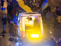 A destroyed medical vehicle is displayed as two hundred people march in silence to mark 1000 days since the full-scale war between Ukraine a...