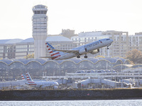 American Airlines Boeing 737 MAX 8 passenger aircraft spotted during takeoff and flying in front of the airport terminal, air traffic contro...