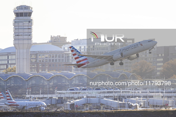 American Airlines Boeing 737 MAX 8 passenger aircraft spotted during takeoff and flying in front of the airport terminal, air traffic contro...