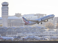 American Airlines Boeing 737 MAX 8 passenger aircraft spotted during takeoff and flying in front of the airport terminal, air traffic contro...