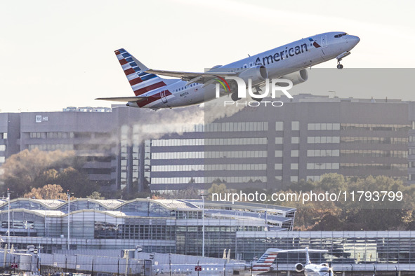 American Airlines Boeing 737 MAX 8 passenger aircraft spotted during takeoff and flying in front of the airport terminal, air traffic contro...