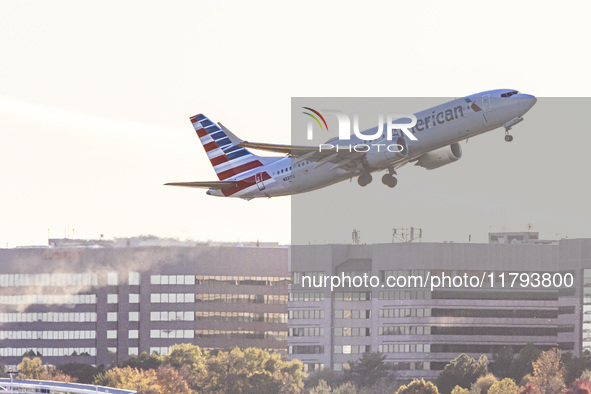 American Airlines Boeing 737 MAX 8 passenger aircraft spotted during takeoff and flying in front of the airport terminal, air traffic contro...