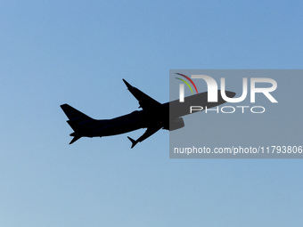 Silhouette of a Boeing 737 MAX8 passing in front of the sun during the flight. American Airlines Boeing 737 MAX 8 passenger aircraft spotted...