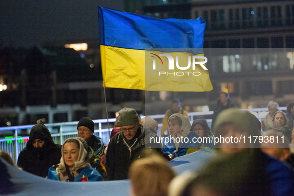 Two hundred people take part in a demonstration to mark 1,000 days since the full-scale war between Ukraine and Russia in Cologne, Germany,...