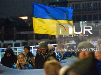 Two hundred people take part in a demonstration to mark 1,000 days since the full-scale war between Ukraine and Russia in Cologne, Germany,...