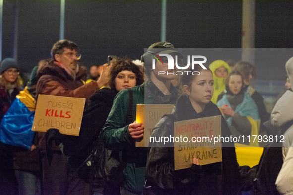 Two hundred people take part in a demonstration to mark 1,000 days since the full-scale war between Ukraine and Russia in Cologne, Germany,...