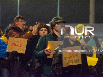 Two hundred people take part in a demonstration to mark 1,000 days since the full-scale war between Ukraine and Russia in Cologne, Germany,...