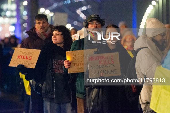 Two hundred people take part in a demonstration to mark 1,000 days since the full-scale war between Ukraine and Russia in Cologne, Germany,...